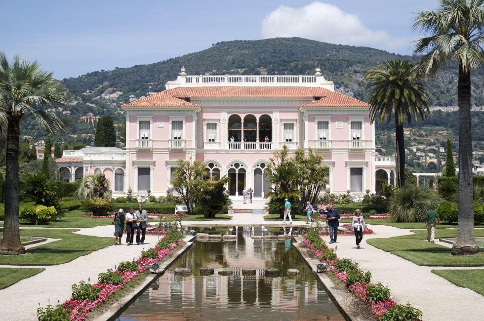 Saint-Jean-Cap-Ferrat, France &#x2013; May 27, 2013: People visiting of Villa Ephrussi de Rothschild is a located at Saint-Jean-Cap-Ferrat on the French Riviera. The villa constructed between 1905 and 1912 by Baroness B&#xe9;atrice de Rothschild, a member 
