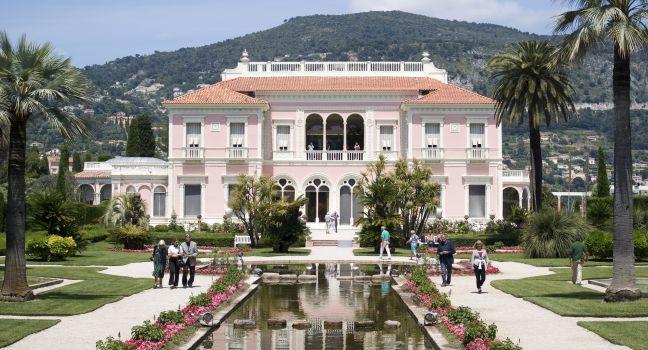 Saint-Jean-Cap-Ferrat, France &#x2013; May 27, 2013: People visiting of Villa Ephrussi de Rothschild is a located at Saint-Jean-Cap-Ferrat on the French Riviera. The villa constructed between 1905 and 1912 by Baroness B&#xe9;atrice de Rothschild, a member 
