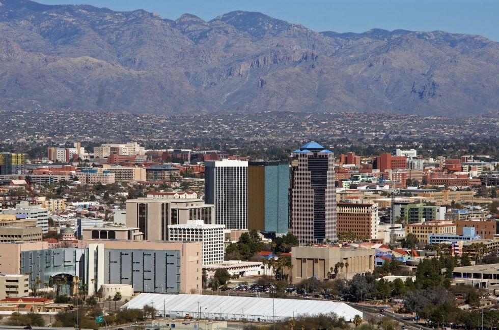 The skyline Tucson Arizona with a background of the Catalina mountains and blue sky.