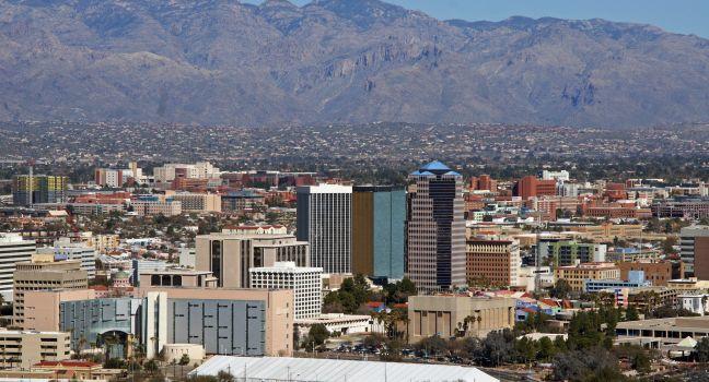 The skyline Tucson Arizona with a background of the Catalina mountains and blue sky.
