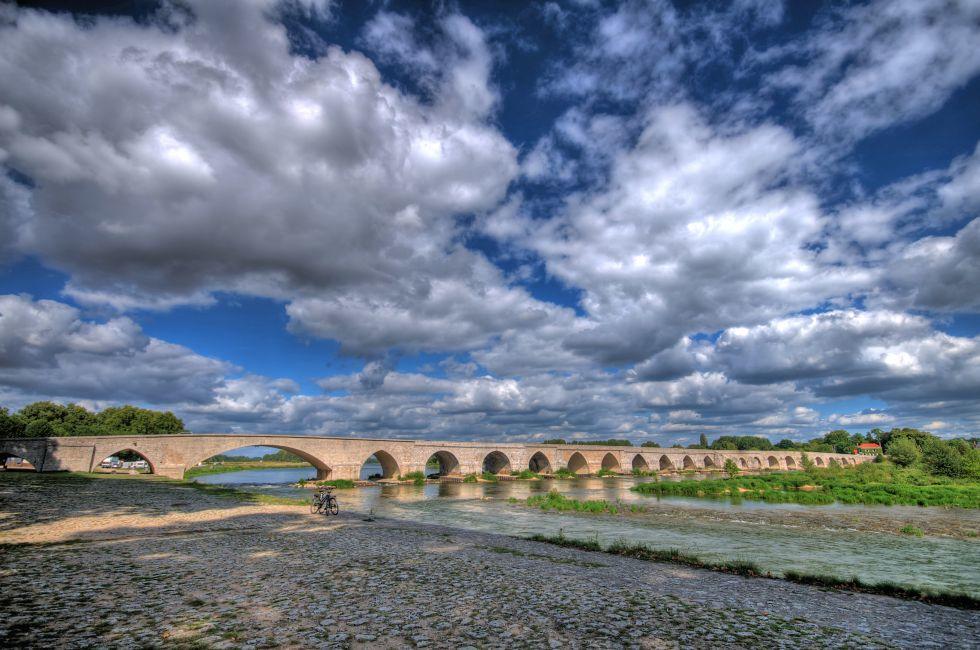 Beaugency Bridge and Dramatic blue skies in Loire department France; 