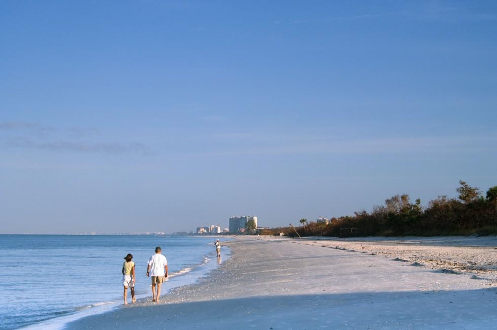 morning walk on florida gulf coast beach; 