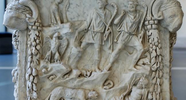 Representation of the lupercal: Romulus and Remus fed by a she-wolf, surrounded by representations of the Tiber and the Palatine. Panel from an alter dedicated to the divine couple of Mars and Venus. Marble, Roman artwork of the end of the reign of Trajan 