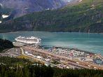 Overlooking Whittier Alaska on a summer day with a large cruise ship in port.