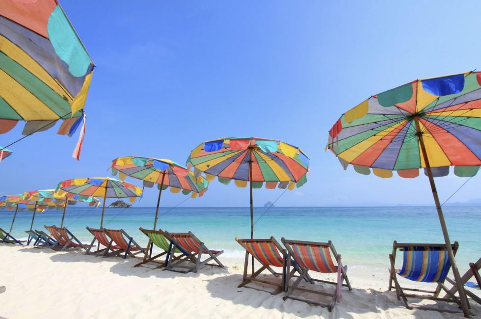Beach chair and colorful umbrella on the beach , Phuket Thailand 
