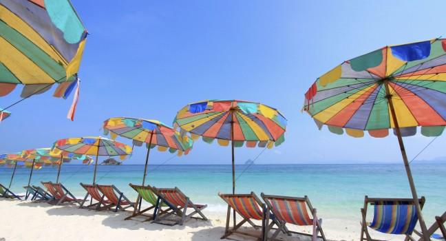Beach chair and colorful umbrella on the beach , Phuket Thailand 