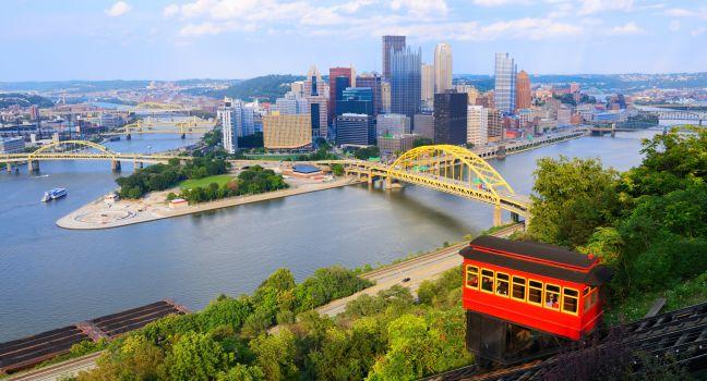 Incline operating in front of the downtown skyline of Pittsburgh, Pennsylvania, USA