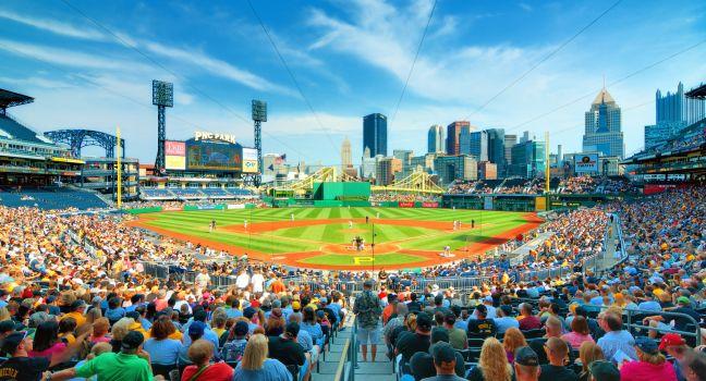 Pirates play the Arizona Diamond Backs at PNC Stadium with the central business district in the the background.