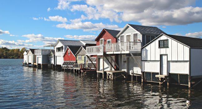 A row of boat houses on Canandaigua Lake in the Finger Lakes region of New York. Boathouses on Canandaigua Lake, New York