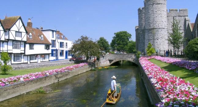 Punt on the moat in front of Canterbury castle Northern gatehouse, Canterbury, England