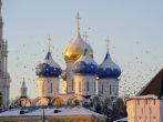 Russia. Moscow region. Sergiev Posad. Troitse-Sergieva Lavra at a sunset. Whirl of a flock of birds between domes. Winter postcard; Shutterstock ID 42423580; Project/Title: Moscow ebook
