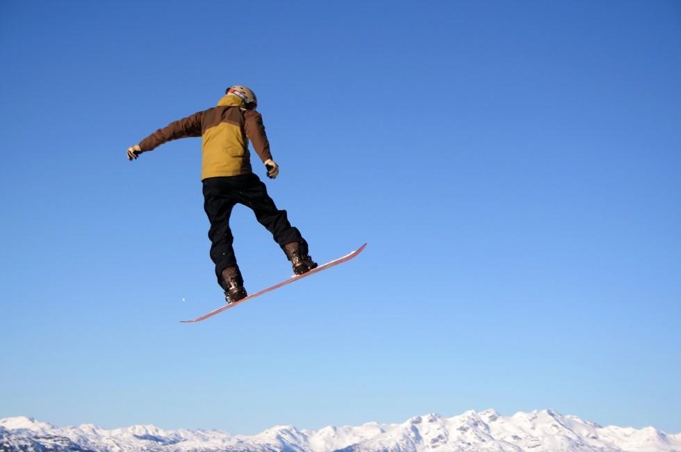 A snowboarder flies through the air with ease in Whistler, BC.; Shutterstock ID 2598407; Project/Title: North America's Best Winter Festivals; Downloader: Melanie Marin