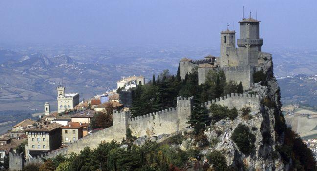 Capping a limstone peak on Mount Titano, the 11th Century Guaita is one of the Three Towers in San Marino, the world's oldest republic, founded by a stonecutter in 301. San Marino, Italy