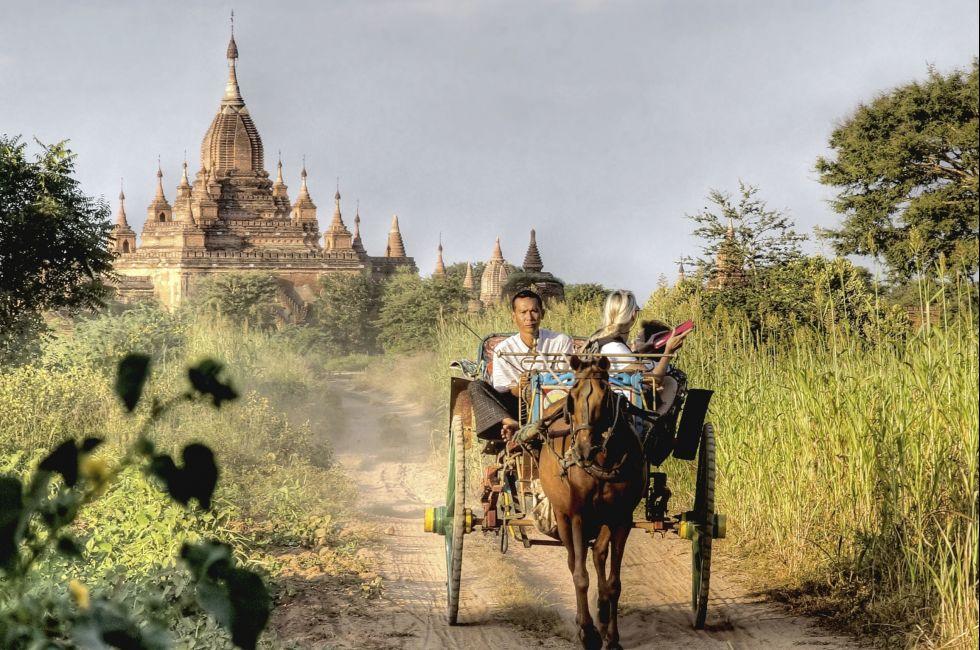 BAGAN, MYANMAR - NOVEMBER 4; Tourist are visiting the Bagan valley by pony cart on Nov. 4 2011, Bagan, Myanmar.Bagan contains thousands of ancient pagodas and temples , all UNESCO protected.