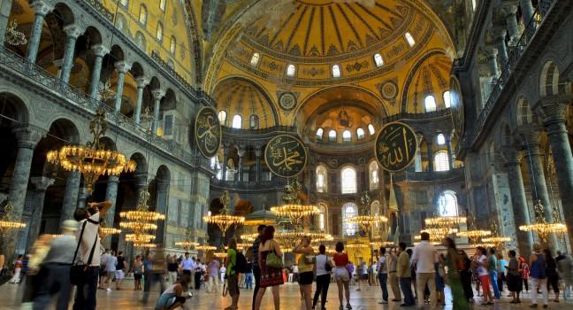 ISTANBUL,TURKEY - AUGUST 15: Tourists visit Hagia Sophia on August 15, 2012 in Istanbul, Turkey. Hagia Sophia is a former Orthodox patriarchal basilica, later a mosque and now a museum.