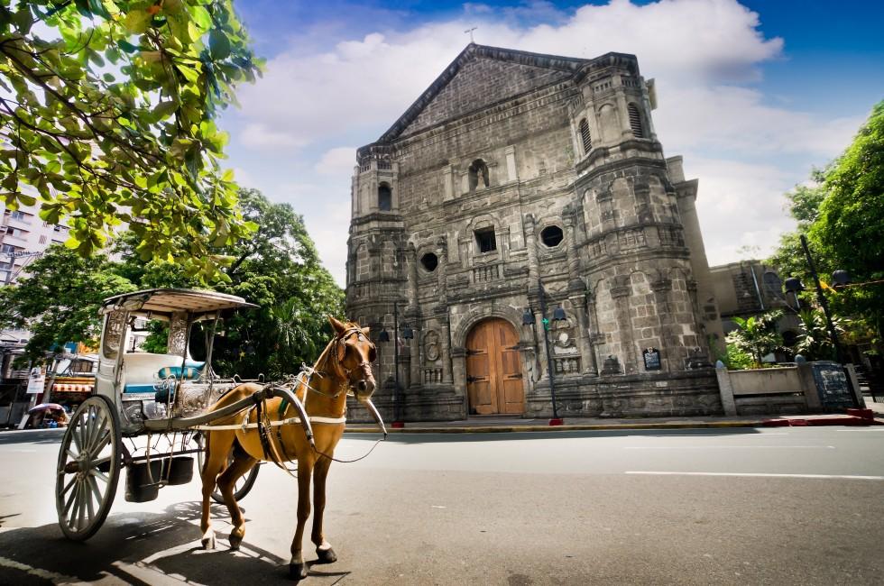 Horse Drawn Carriage parking in front of Malate church , Manila Philippines; 
